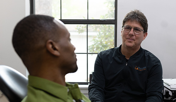 Dr. Alex Touchstone consulting with patient